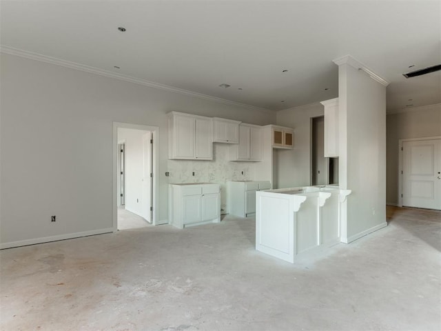 kitchen featuring ornamental molding and white cabinets