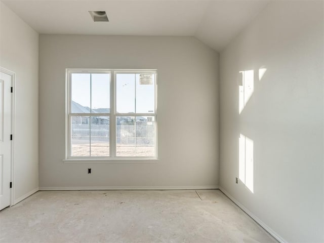 spare room featuring lofted ceiling and a mountain view