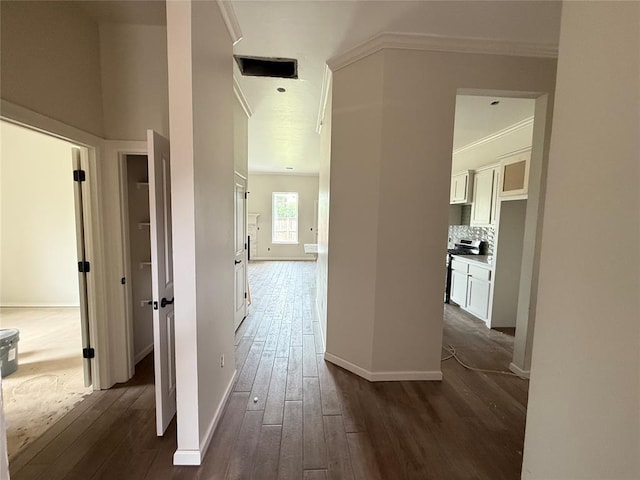 3305 NW 178th Ter, Edmond, OK 73012 - hallway with crown molding, dark wood-type flooring, and baseboards