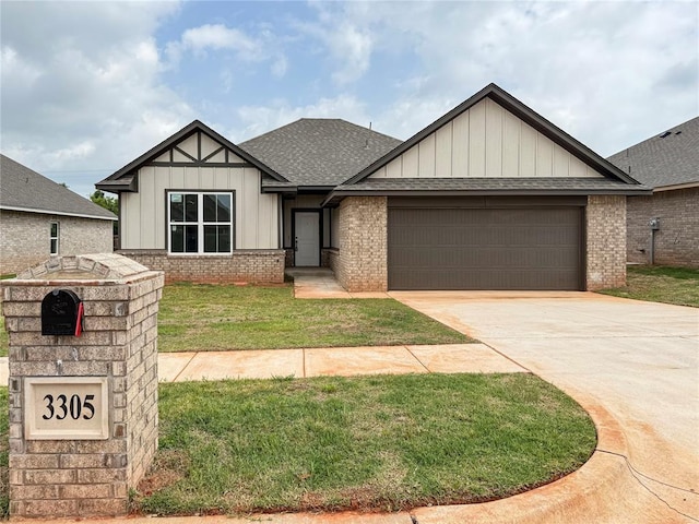 3305 NW 178th Ter, Edmond, OK 73012 - view of front of property with board and batten siding, brick siding, an attached garage, a shingled roof, and a front yard