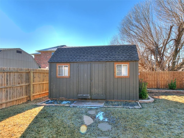 view of outbuilding with a lawn