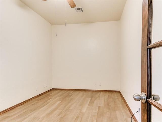 empty room featuring ceiling fan and light hardwood / wood-style floors