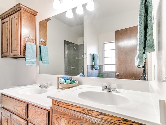 bathroom with an enclosed shower and vanity