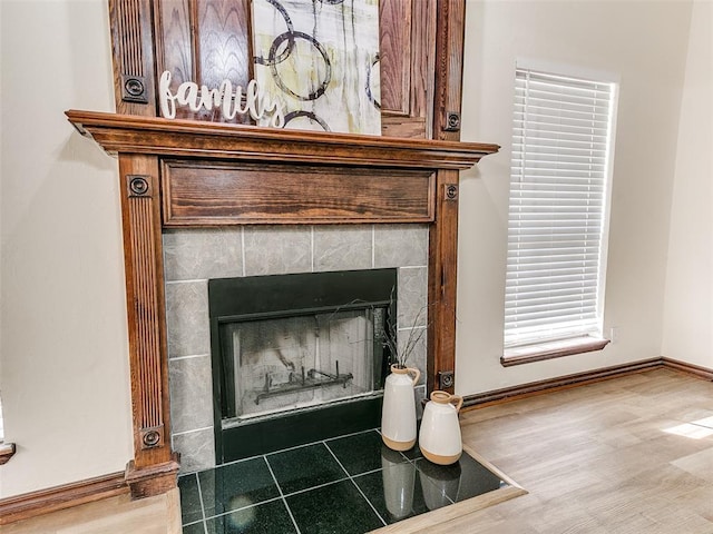 details featuring a tiled fireplace