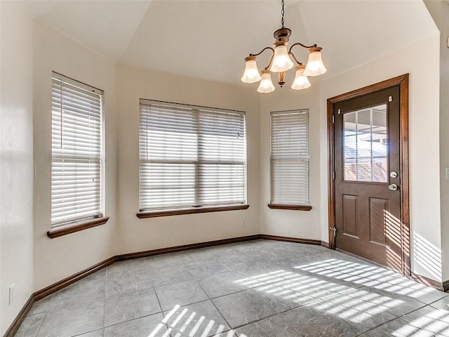 unfurnished dining area with lofted ceiling and a notable chandelier