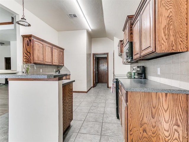 kitchen with kitchen peninsula, decorative light fixtures, tasteful backsplash, electric range, and light tile patterned flooring