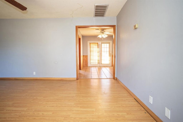 interior space featuring french doors and light hardwood / wood-style floors