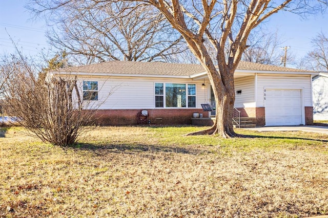 single story home featuring a front yard and a garage