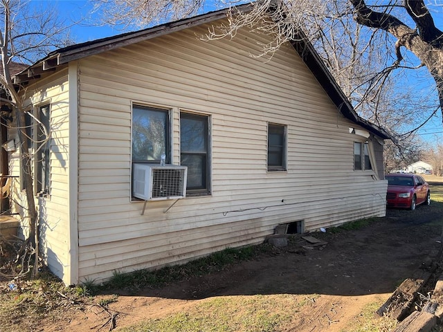 view of home's exterior with cooling unit