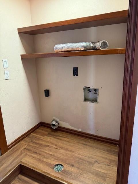 washroom with hardwood / wood-style flooring, hookup for a washing machine, and hookup for an electric dryer