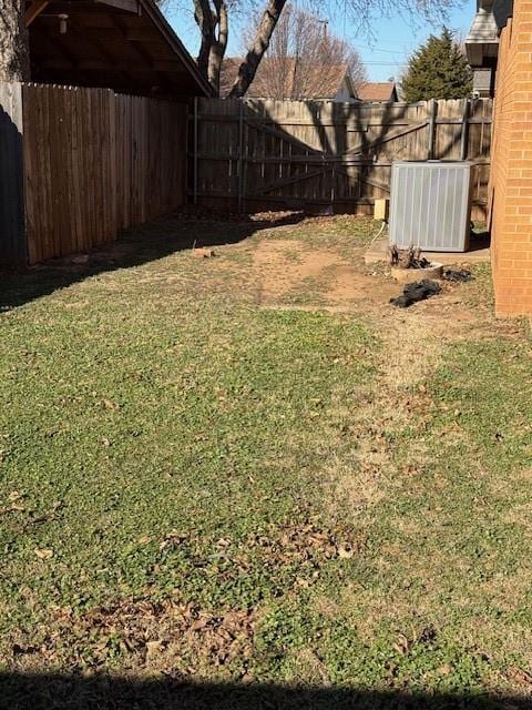 view of yard with central air condition unit