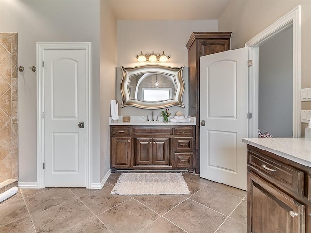 bathroom with tile patterned flooring and vanity