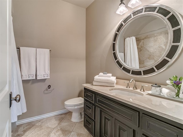 bathroom featuring tile patterned flooring, vanity, walk in shower, and toilet