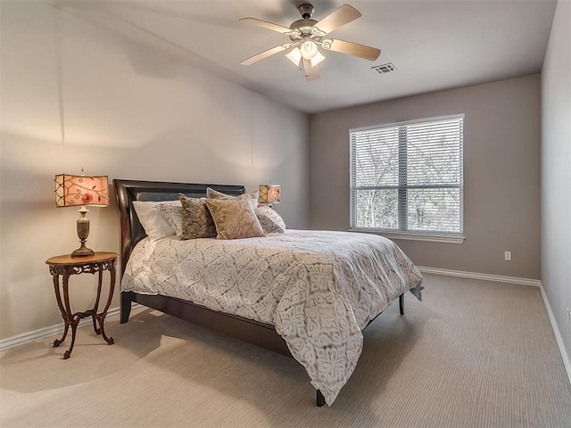 bedroom with ceiling fan and carpet