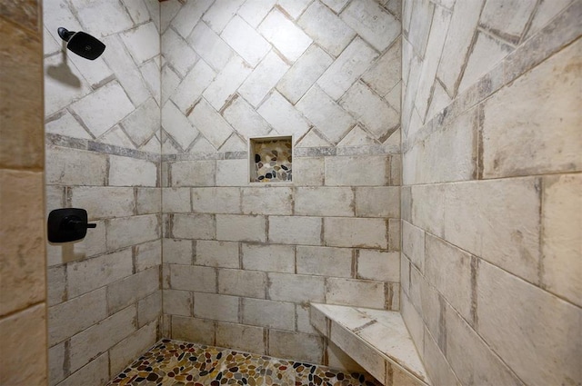 bathroom featuring a tile shower