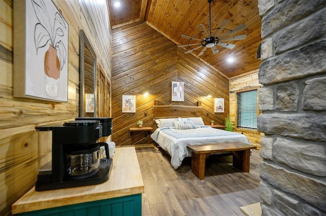 bedroom with wooden ceiling, wood walls, wood-type flooring, ceiling fan, and lofted ceiling