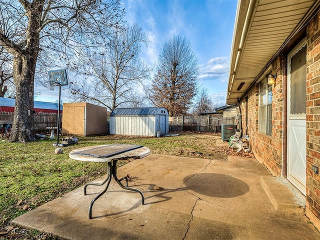 view of patio featuring a storage shed and cooling unit