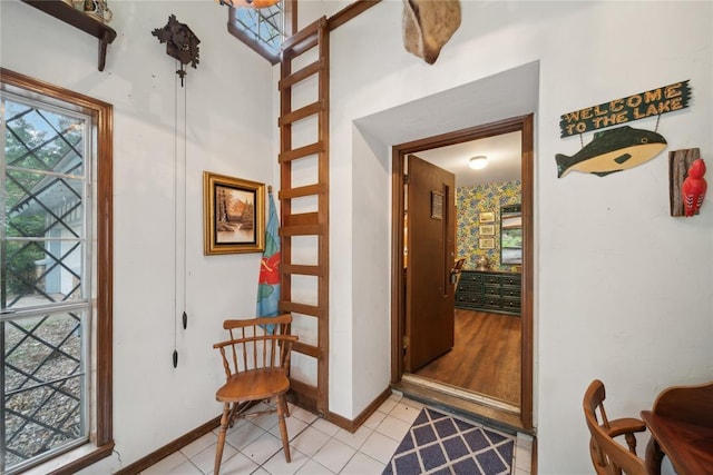 entryway with light tile patterned flooring