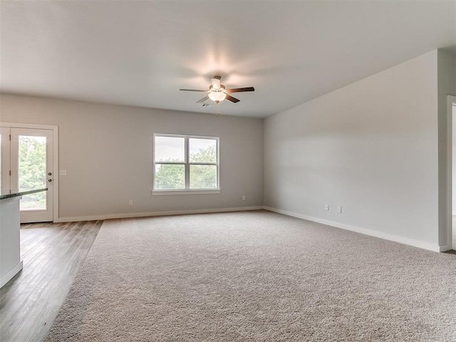 13156 Mannington Rd, Edmond, OK 73025 - spare room with a ceiling fan, baseboards, and light wood finished floors