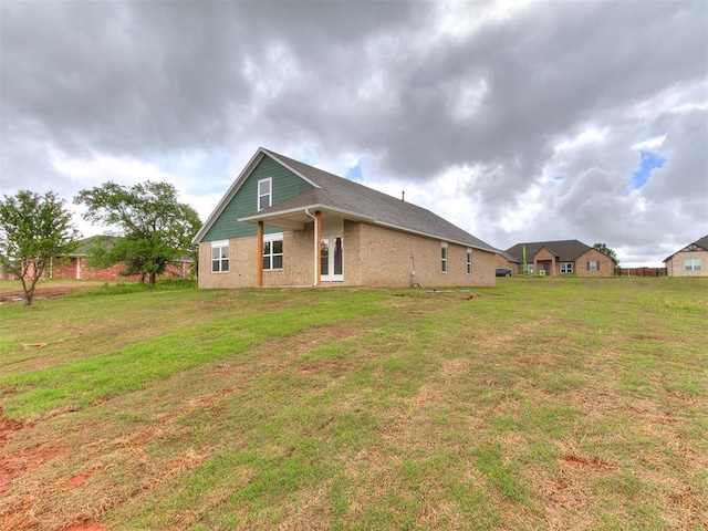 13156 Mannington Rd, Edmond, OK 73025 - back of house with a yard and brick siding