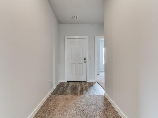 13156 Mannington Rd, Edmond, OK 73025 - entryway featuring dark colored carpet and baseboards