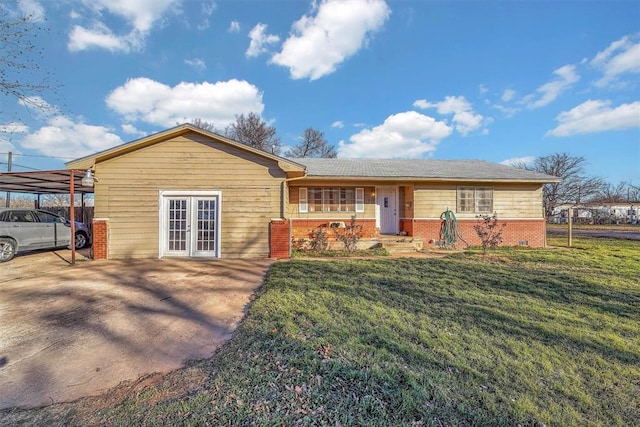 ranch-style house with french doors, a carport, and a front yard