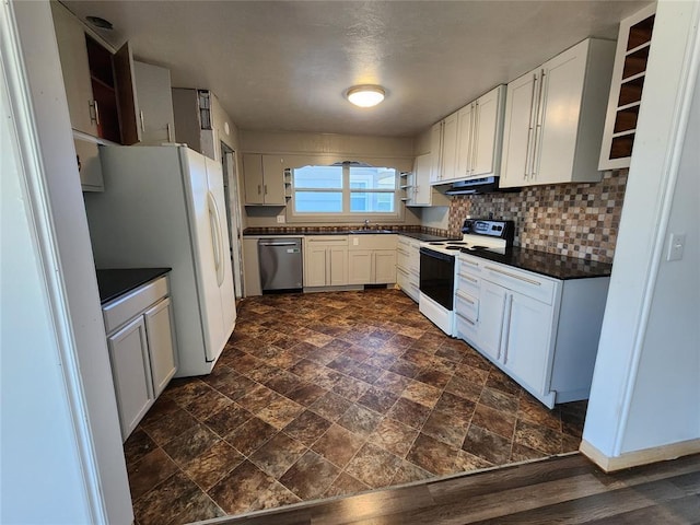 kitchen with white appliances, white cabinetry, and tasteful backsplash