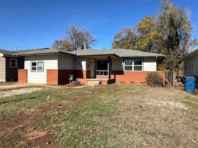 ranch-style house with a front lawn