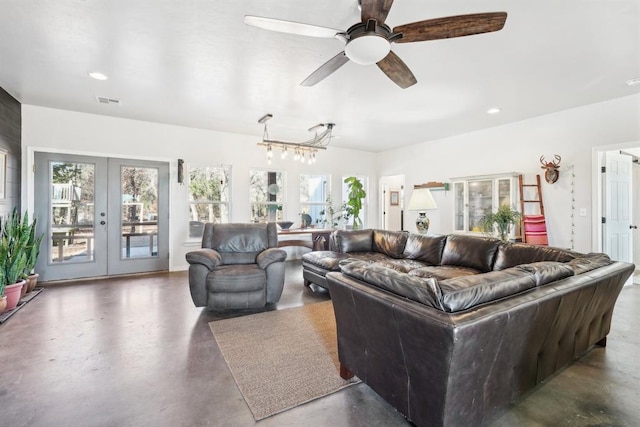 living room featuring ceiling fan and french doors