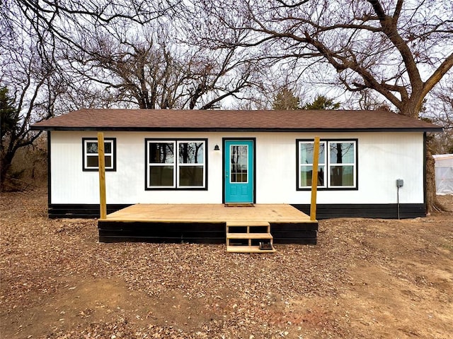 ranch-style house with a wooden deck