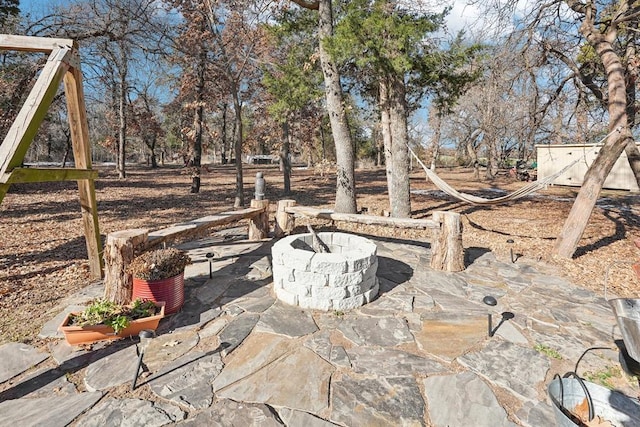 view of patio with an outdoor fire pit