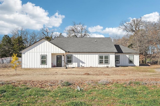 view of front of property featuring roof with shingles and board and batten siding