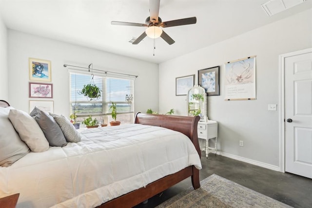 bedroom featuring ceiling fan, concrete floors, and baseboards