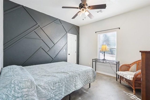 carpeted bedroom featuring a ceiling fan, visible vents, and baseboards