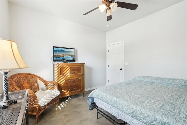 bedroom with ceiling fan and baseboards