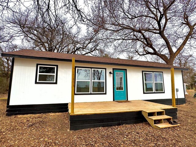 single story home featuring a deck