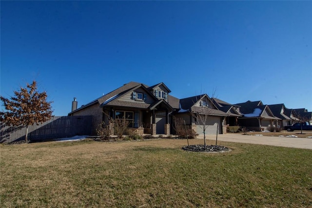 view of front facade featuring a front lawn and a garage