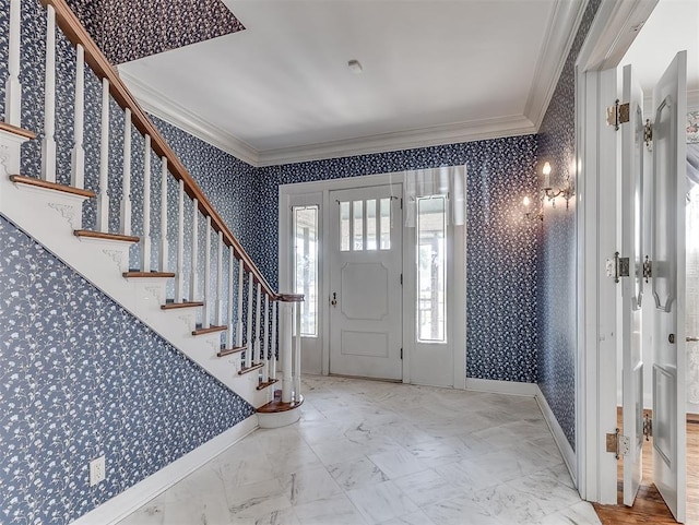 foyer featuring crown molding