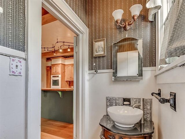 bathroom with vanity and hardwood / wood-style floors