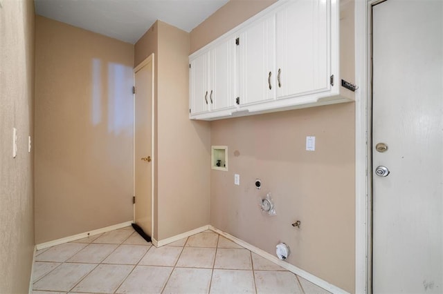 laundry room with hookup for an electric dryer, light tile patterned floors, hookup for a washing machine, cabinets, and gas dryer hookup