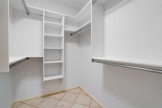 spacious closet with light tile patterned flooring