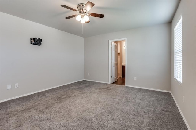 unfurnished room featuring ceiling fan and carpet flooring