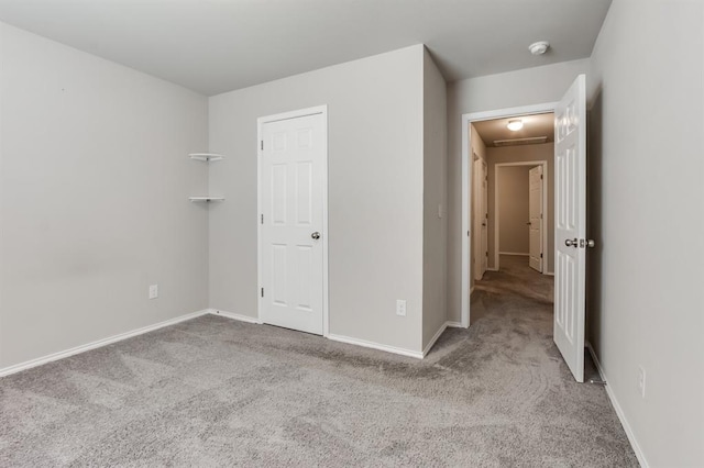 spare room featuring light carpet