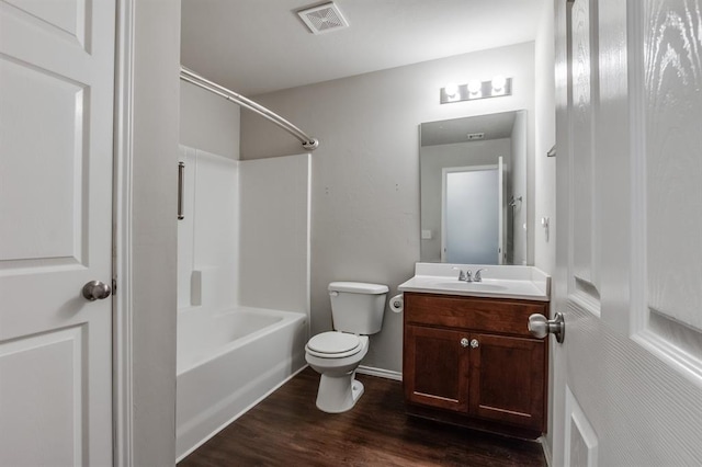 full bathroom featuring toilet, vanity, shower / bathing tub combination, and hardwood / wood-style flooring