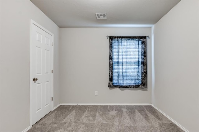 unfurnished room with carpet floors