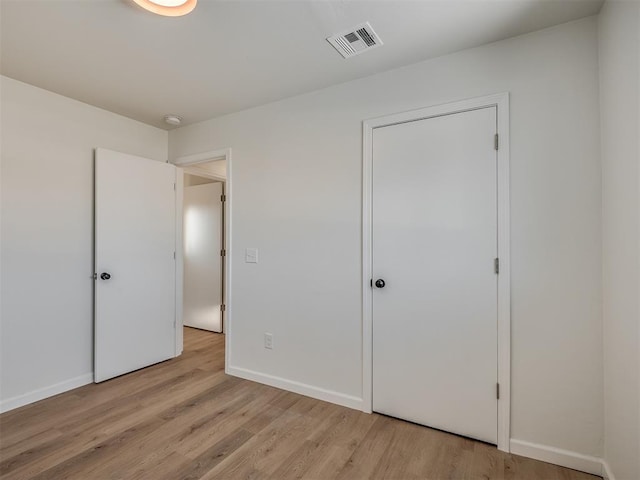 unfurnished bedroom with light hardwood / wood-style flooring