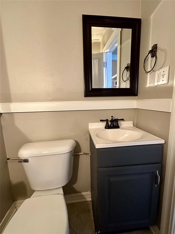 bathroom with vanity and toilet