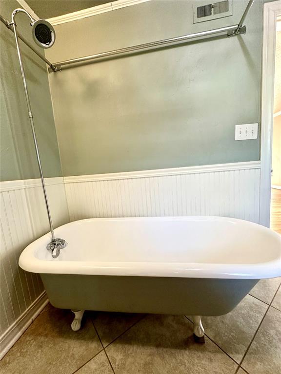 bathroom featuring a tub and tile patterned floors