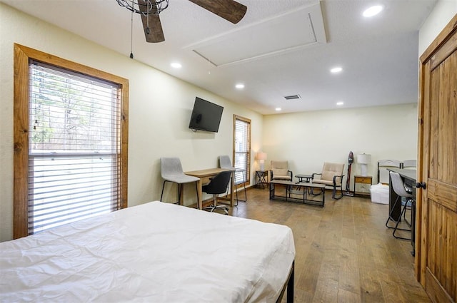 bedroom featuring ceiling fan and hardwood / wood-style flooring