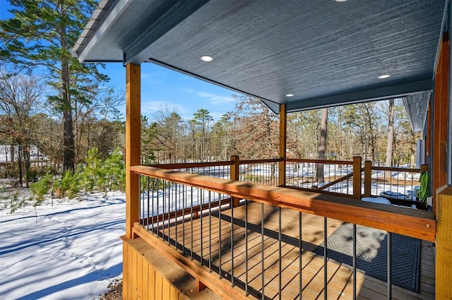 view of snow covered deck